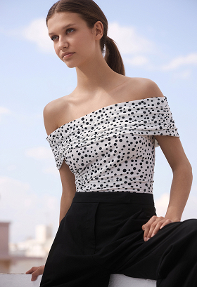 Polka dot blouse with off-the-shoulder style