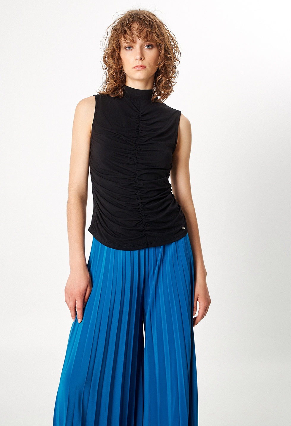 Sleeveless top with gathering