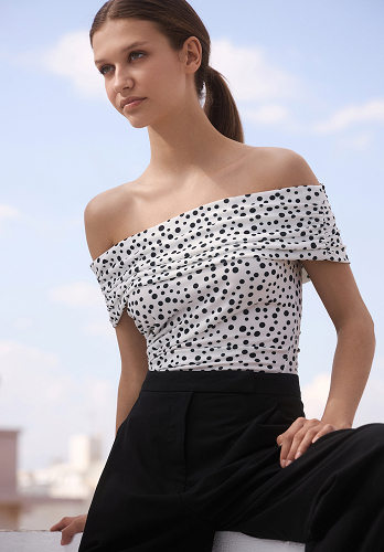 Polka dot blouse with off-the-shoulder style