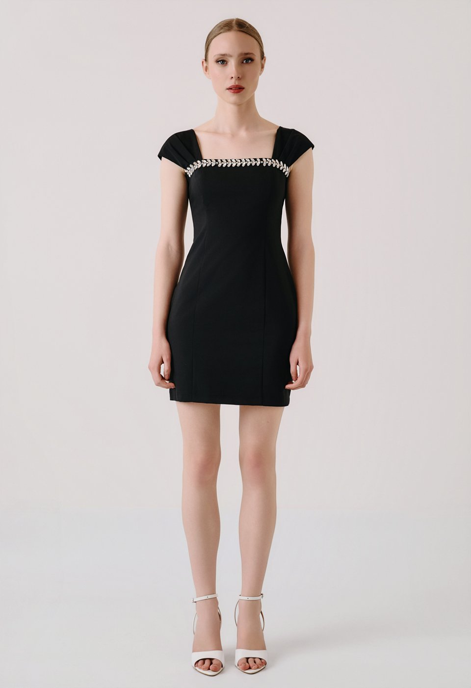 Mini dress with rhinestone detail at the neckline