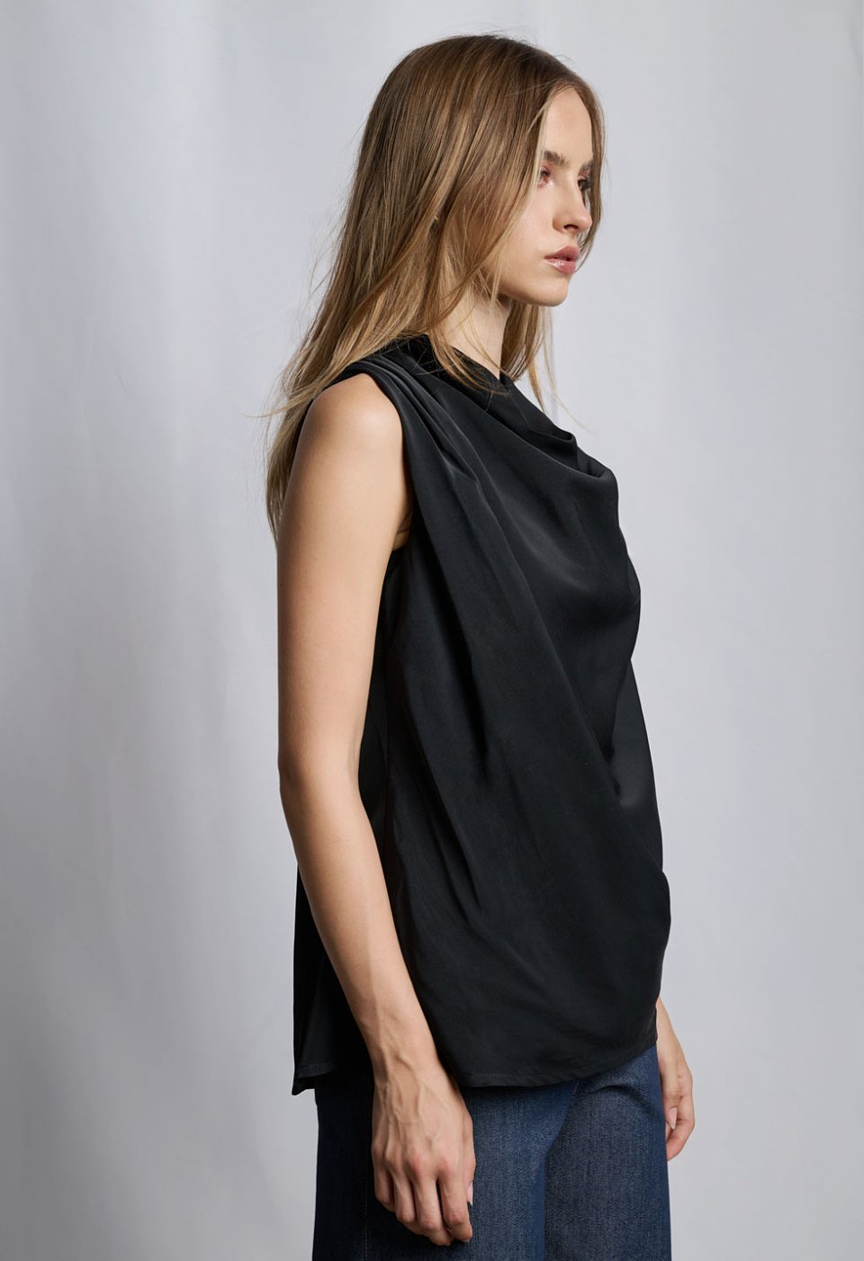 Sleeveless blouse with draped neckline