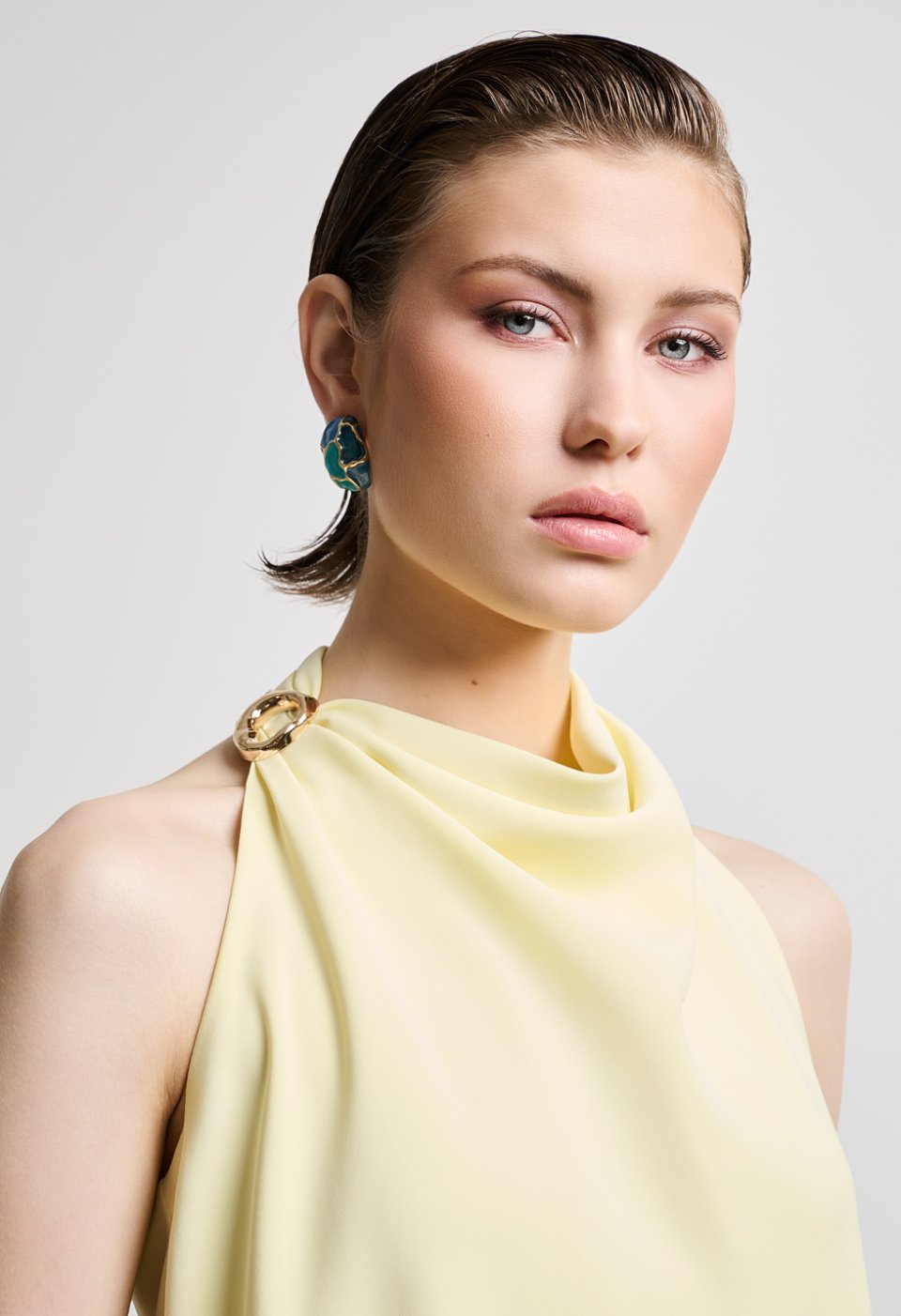 Halter blouse with decorative ring