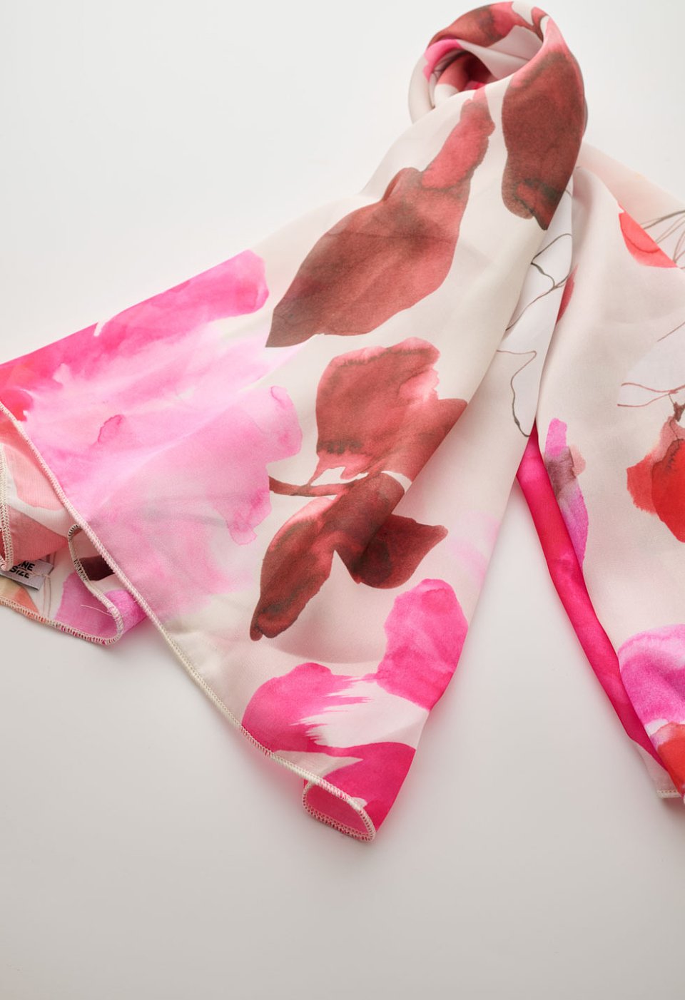 Floral print scarf in pink and red tones