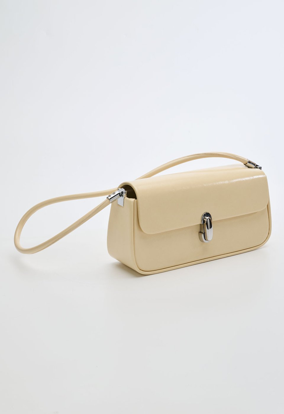 Yellow shoulder bag with twist-lock closure