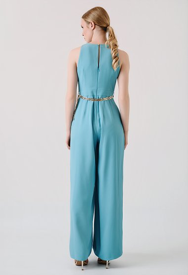 Light blue wide-leg jumpsuit with pleats and gold belt