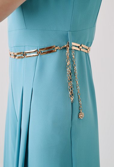 Light blue wide-leg jumpsuit with pleats and gold belt