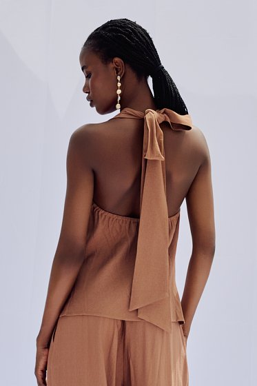 Top with draped neckline
