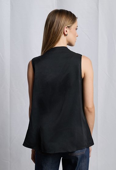 Sleeveless blouse with draped neckline