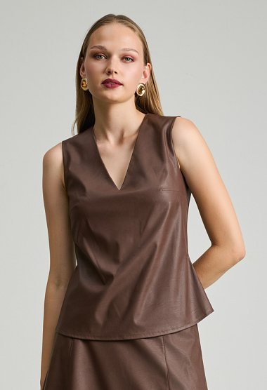 Sleeveless top with leather effect