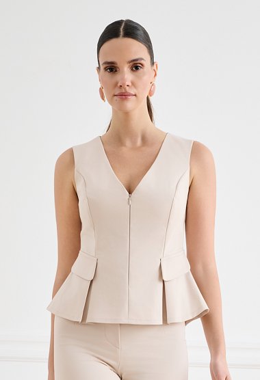 Sleeveless top with peplum and V-neckline