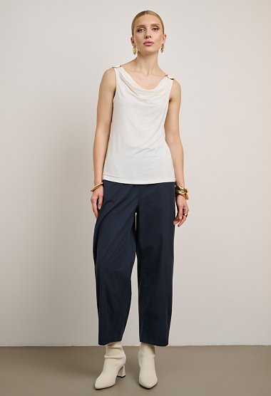 Sleeveless draped top with metallic details