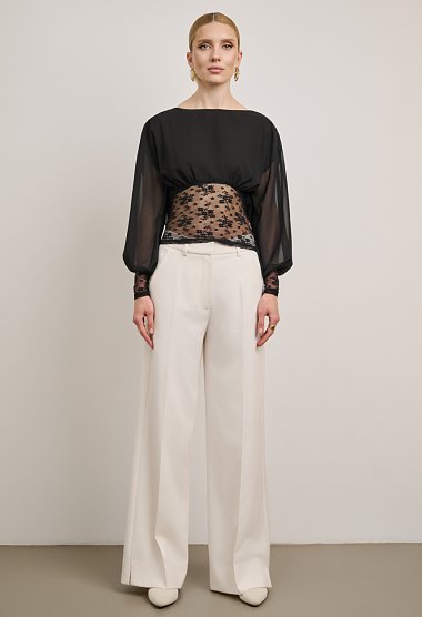 Lace blouse with a sheer back