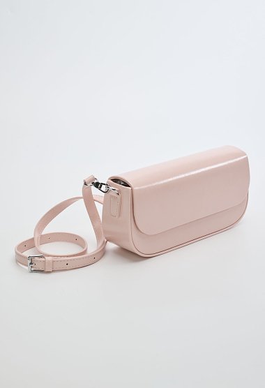 Pink women’s shoulder bag with a magnetic closure