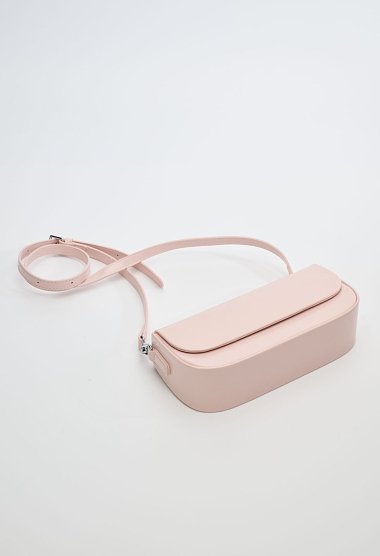 Pink women’s shoulder bag with a magnetic closure