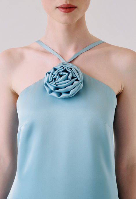 Maxi dress with a flower detail on the neckline