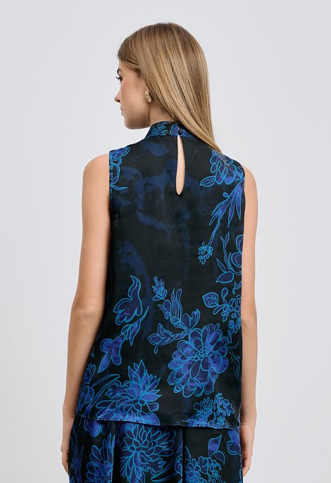 Sleeveless blouse with bow and floral print