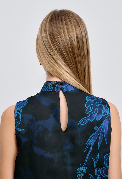 Sleeveless blouse with bow and floral print