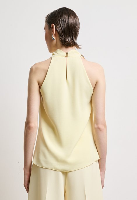 Halter blouse with decorative ring