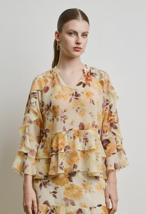 Floral μπλούζα με βολάν