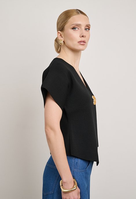 Knit cardigan with decorative fastening