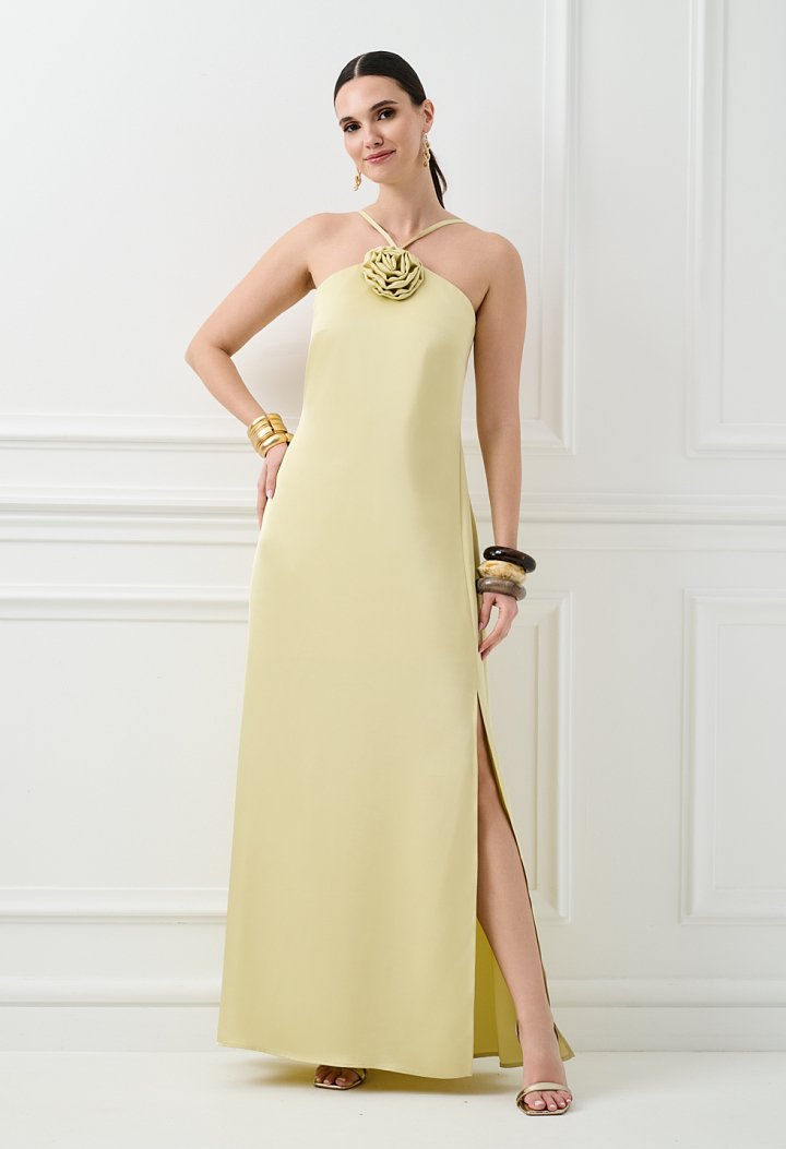Maxi dress with a flower detail on the neckline
