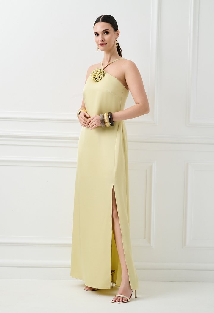 Maxi dress with a flower detail on the neckline