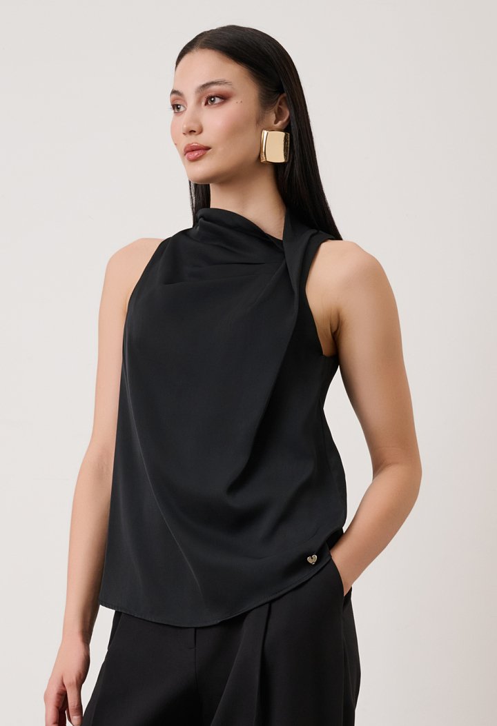 Sleeveless blouse with asymmetric draped neckline