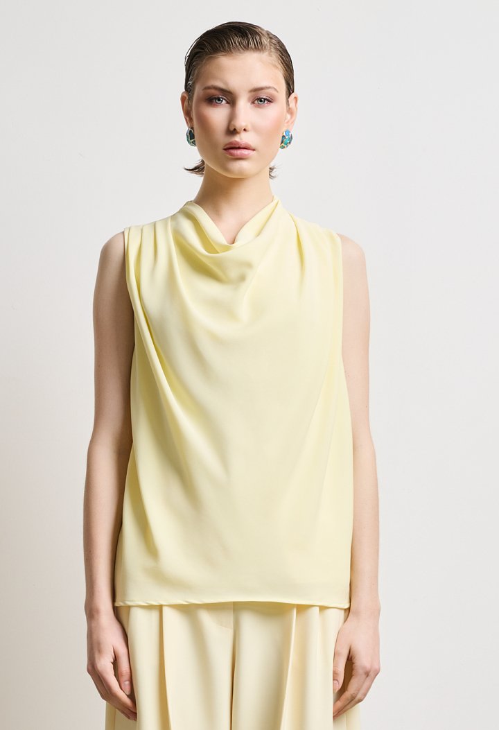 Blouse with draped neckline