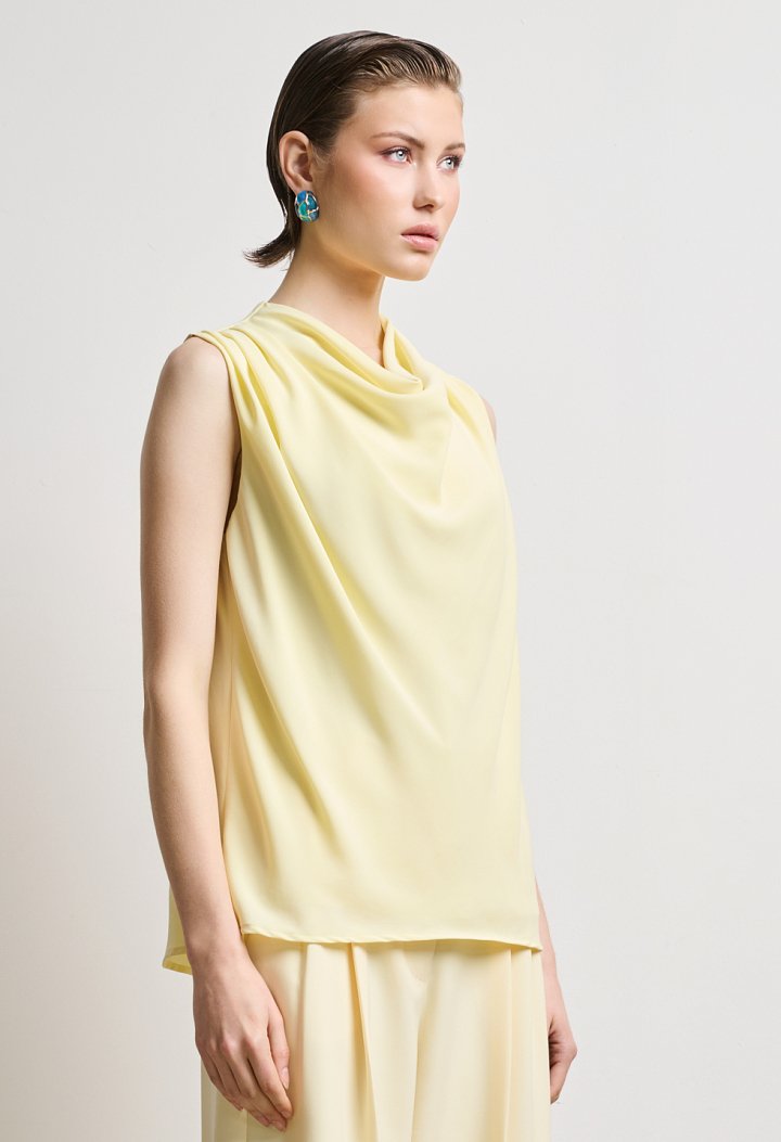 Blouse with draped neckline