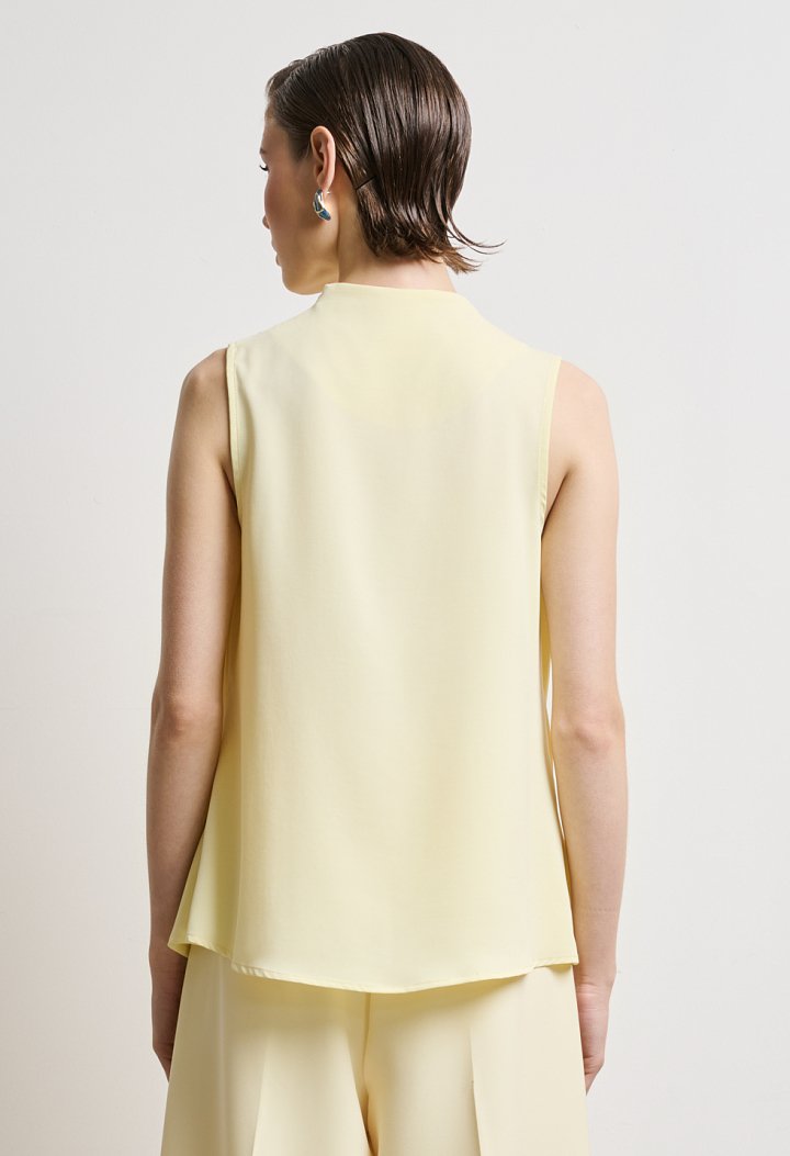 Blouse with draped neckline