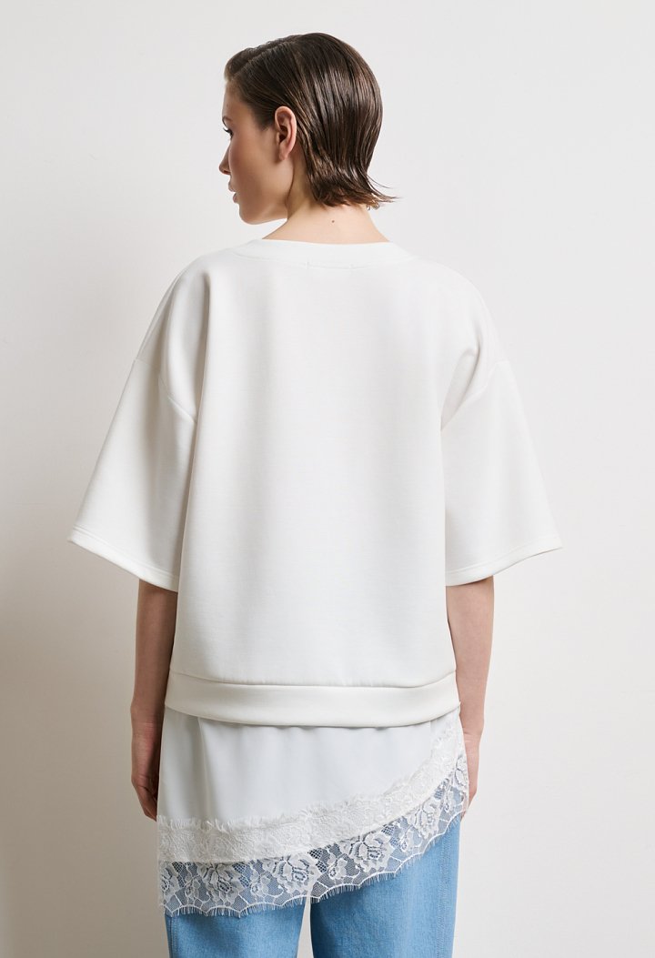 Top with lace trim at the hem