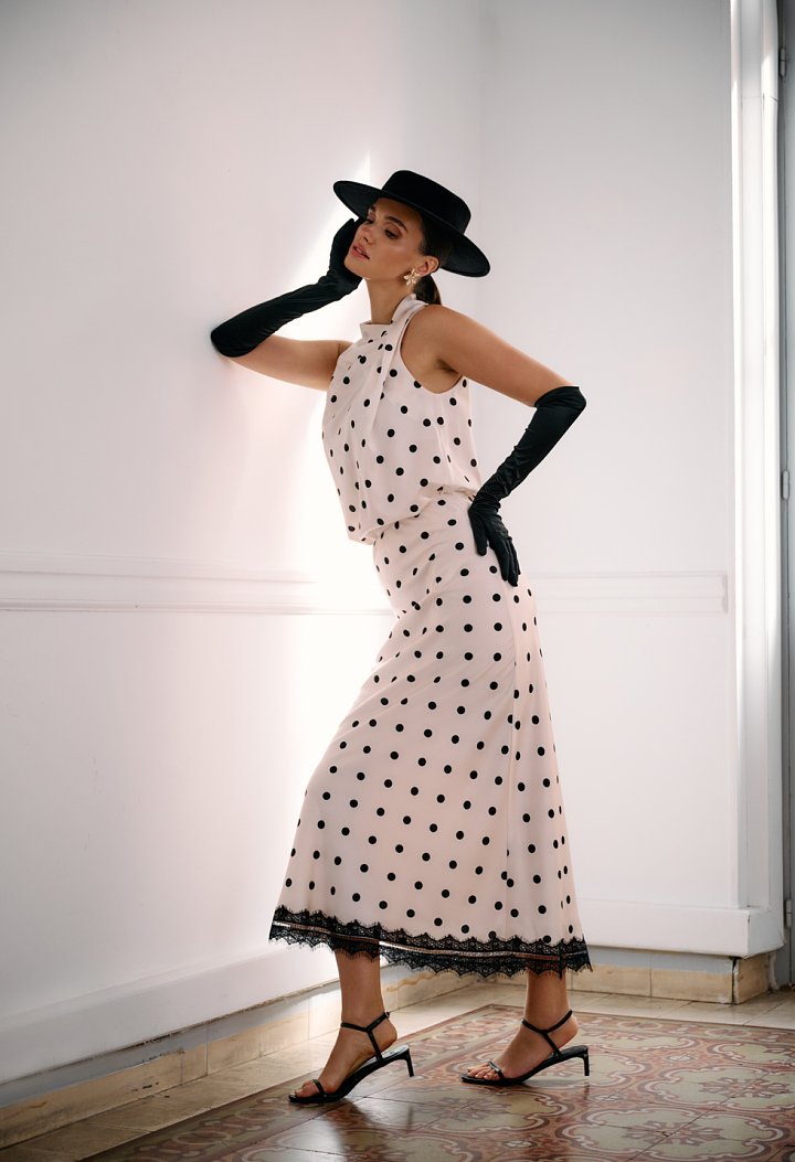 Satin polka-dot blouse with an asymmetrical draped neckline