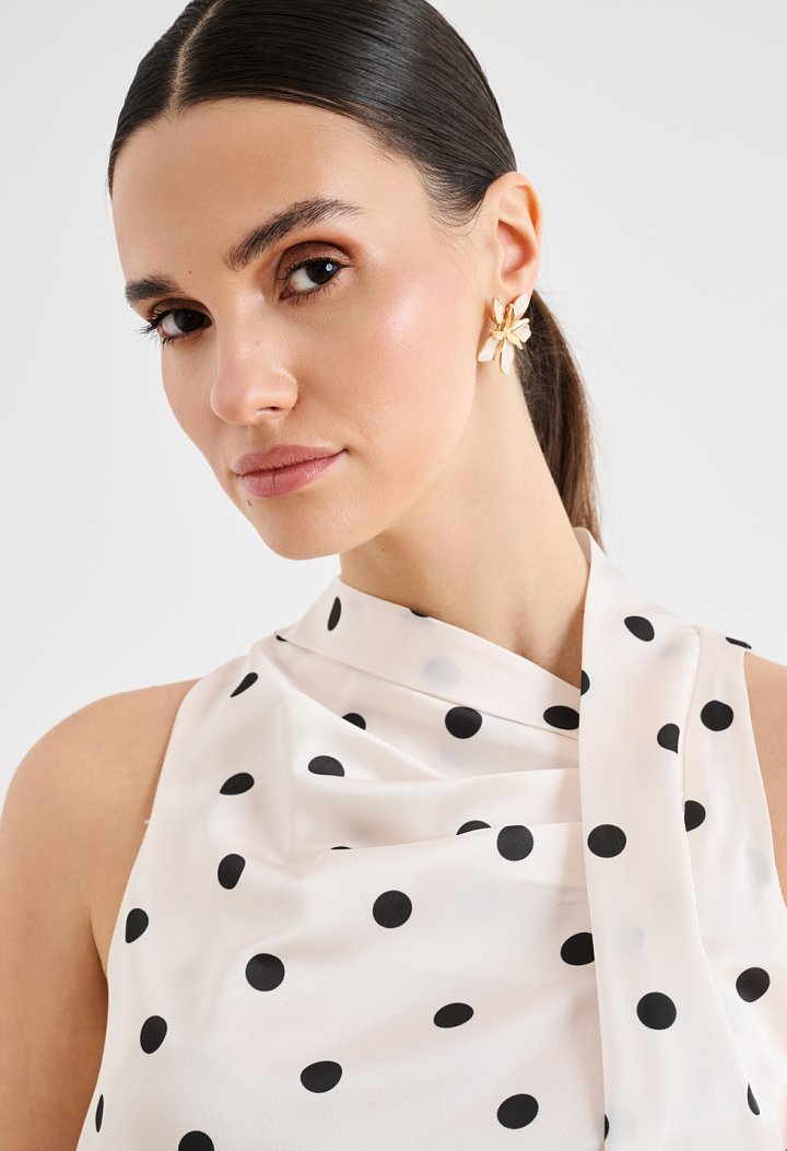 Satin polka-dot blouse with an asymmetrical draped neckline