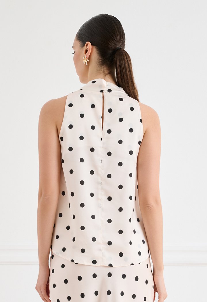 Satin polka-dot blouse with an asymmetrical draped neckline