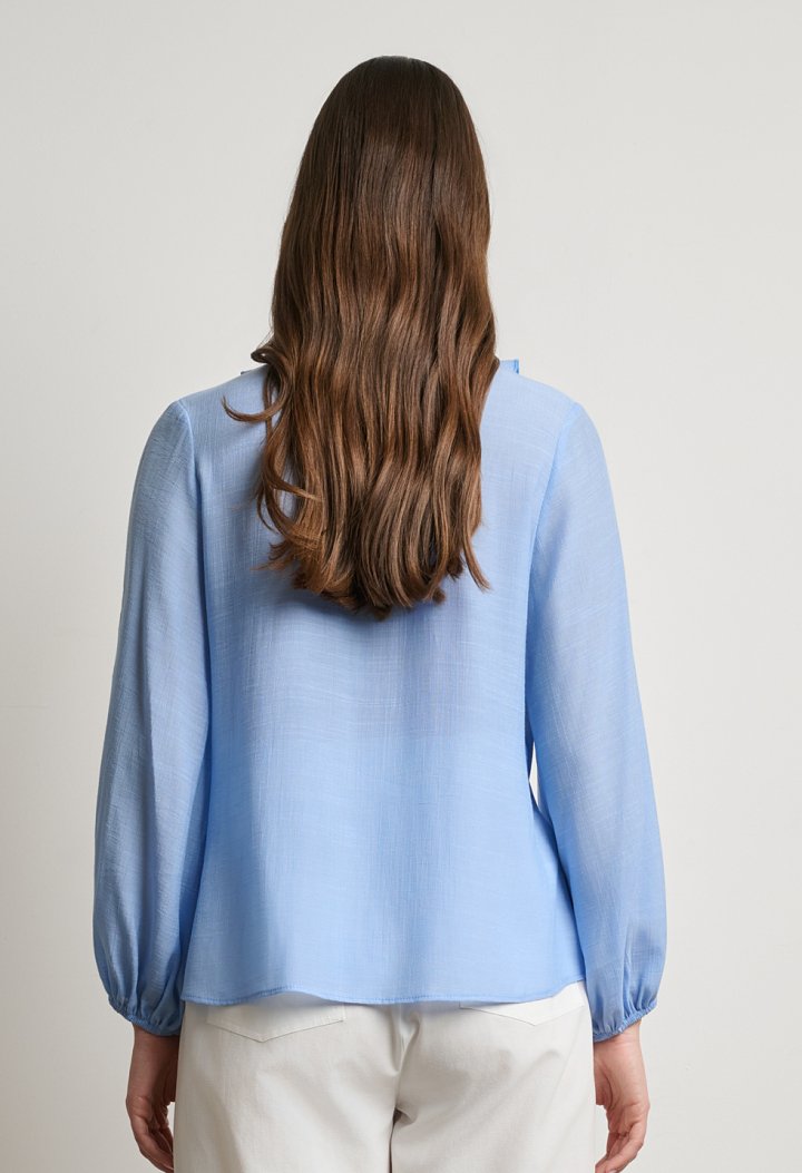 Blouse with ruffles and a V-neckline