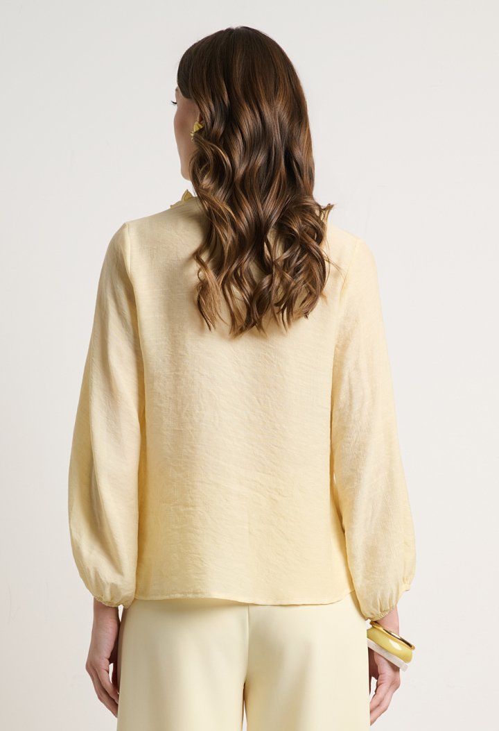 Blouse with ruffles and a V-neckline