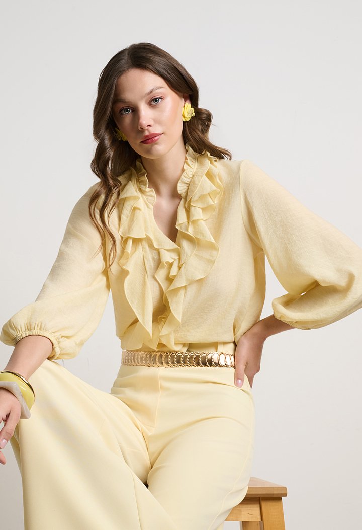 Blouse with ruffles and a V-neckline