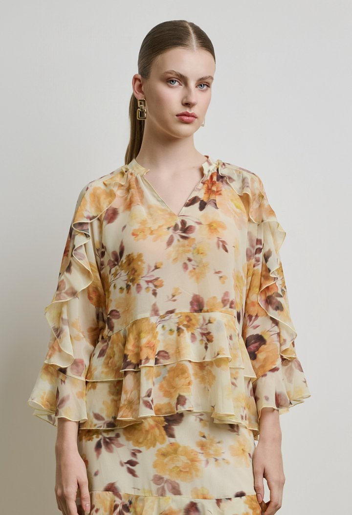 Floral μπλούζα με βολάν