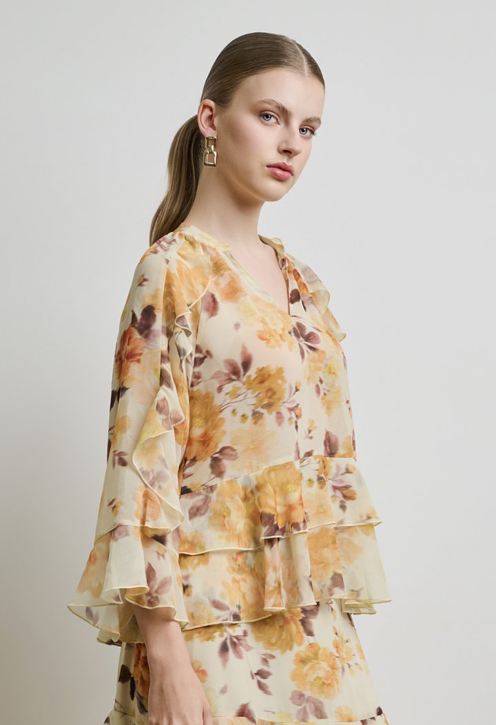 Floral μπλούζα με βολάν