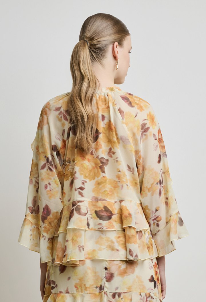 Floral μπλούζα με βολάν