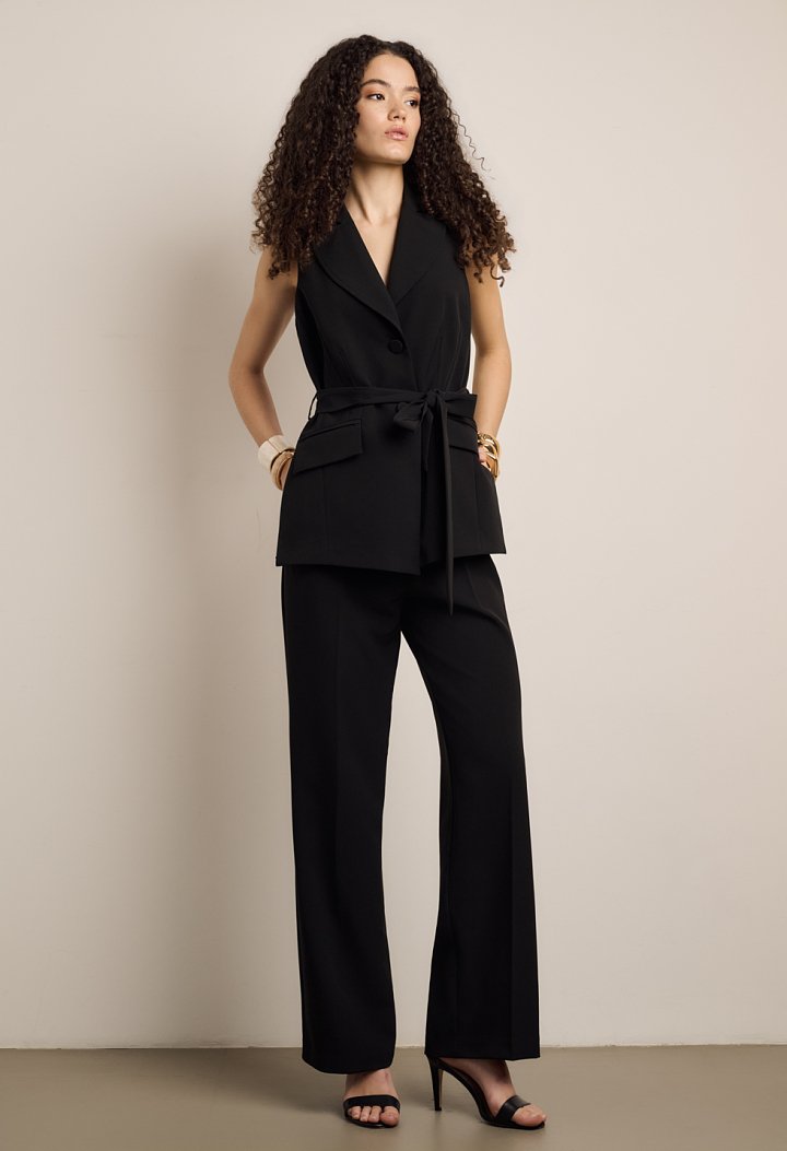 Sleeveless jumpsuit with front buttons and belt