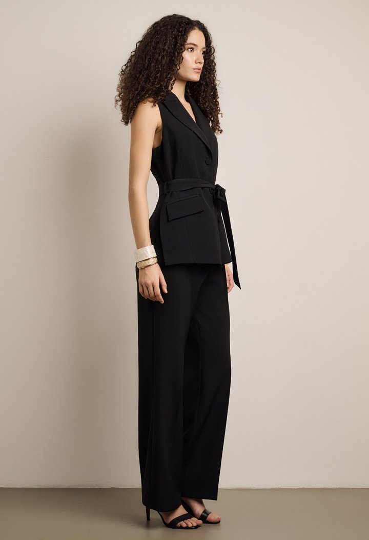 Sleeveless jumpsuit with front buttons and belt