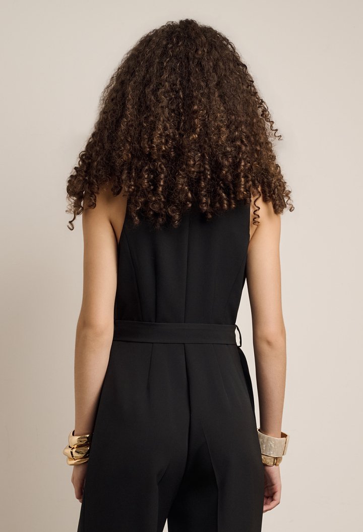Sleeveless jumpsuit with front buttons and belt