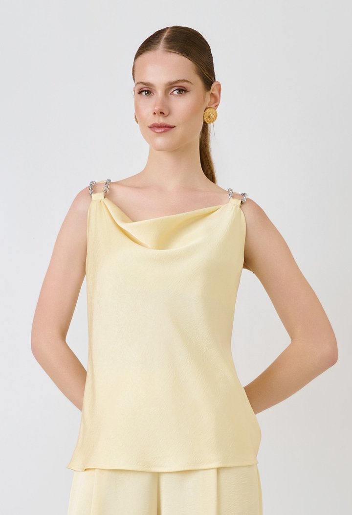 Strappy top with decorative pearls