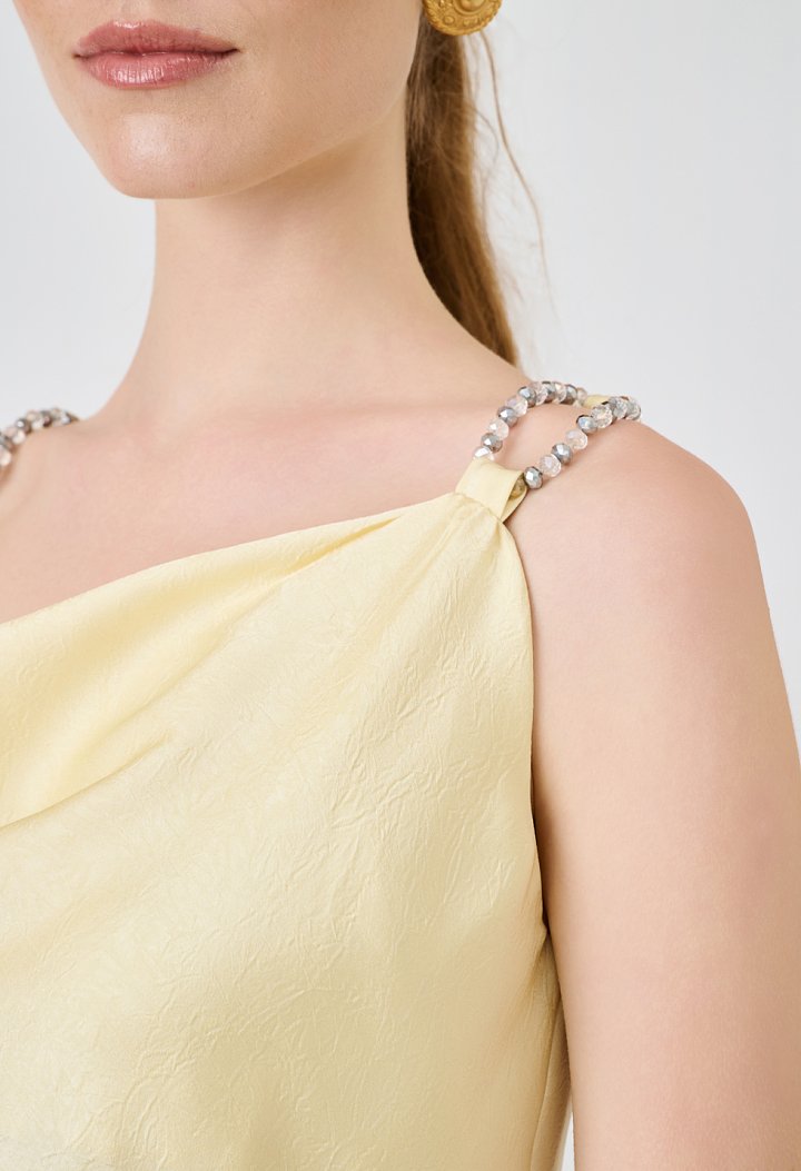 Strappy top with decorative pearls