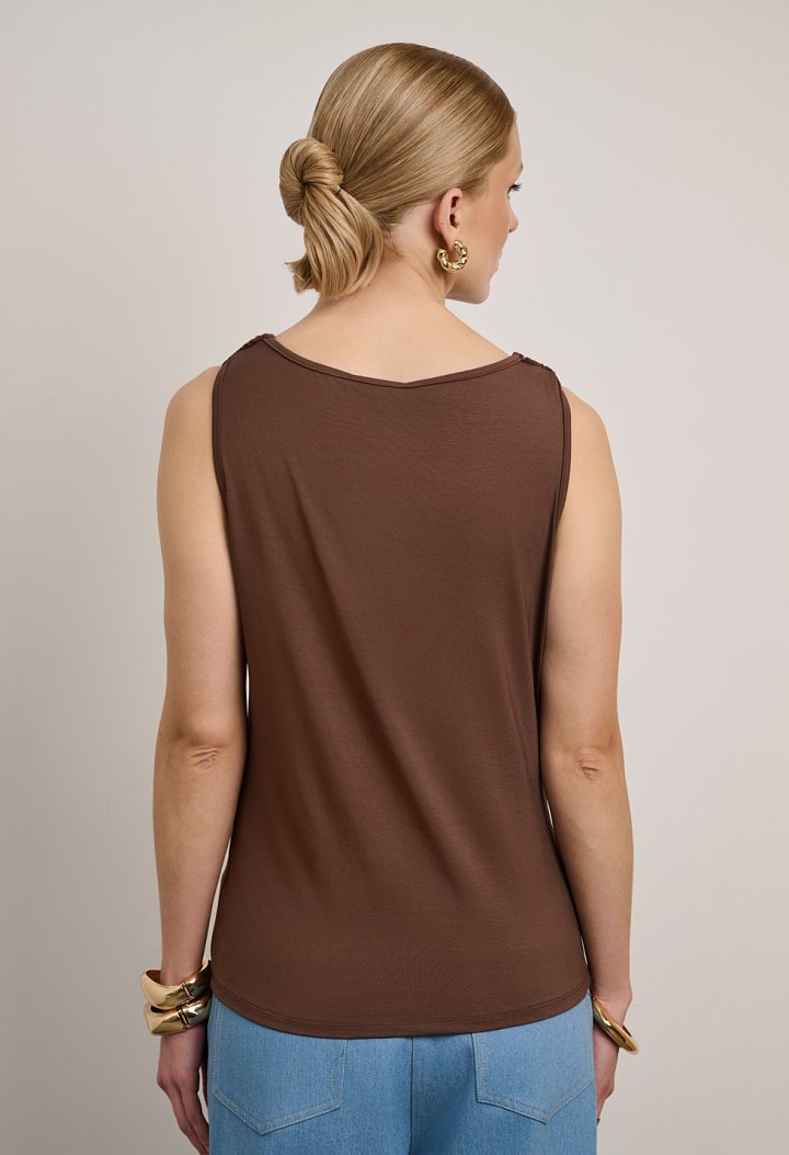 Sleeveless draped top with metallic details