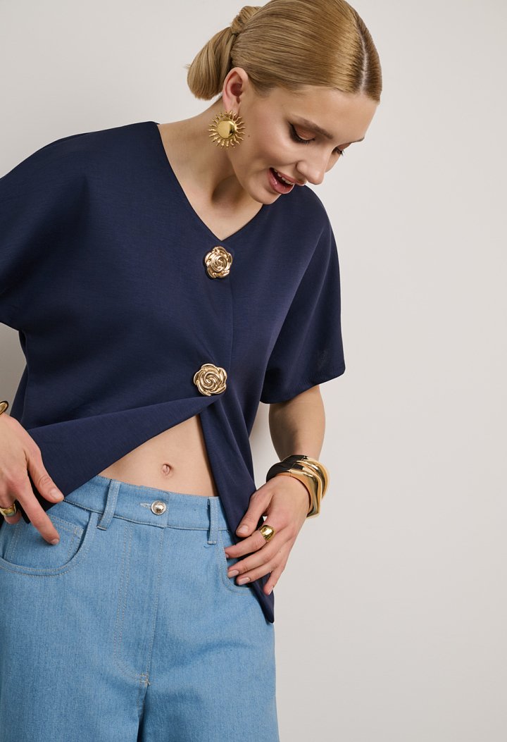 Blouse with a V-neckline and gold buttons