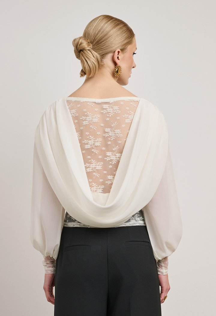 Lace blouse with a sheer back