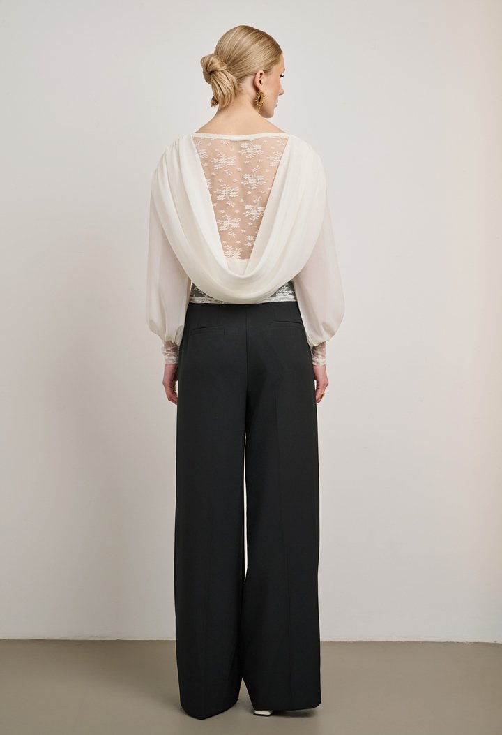 Lace blouse with a sheer back