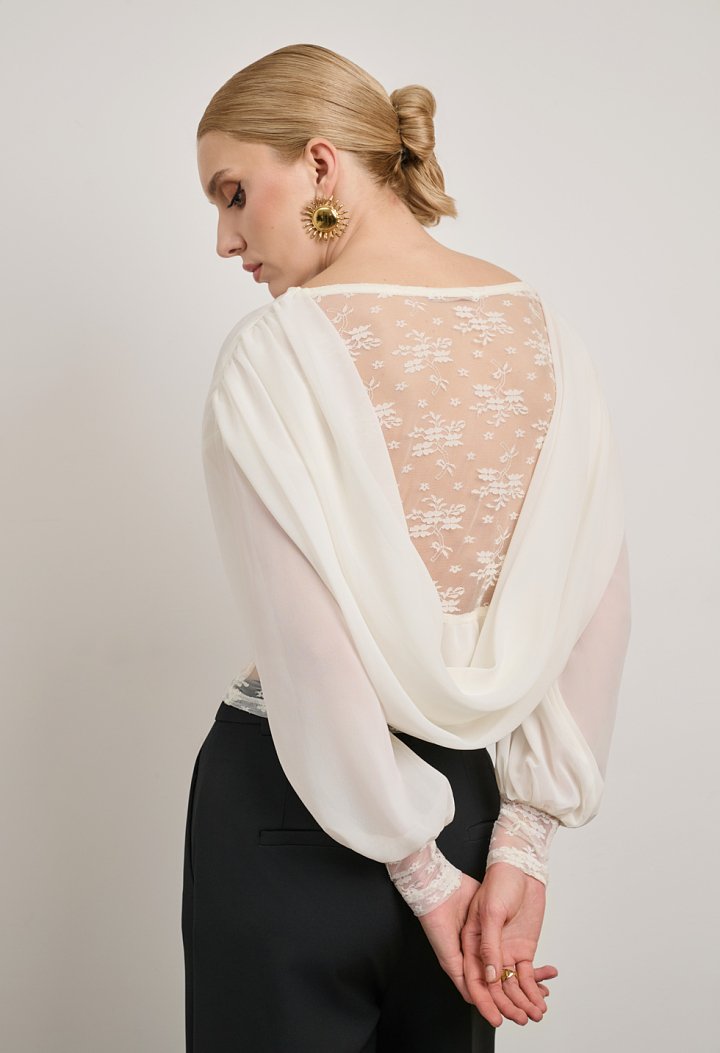 Lace blouse with a sheer back